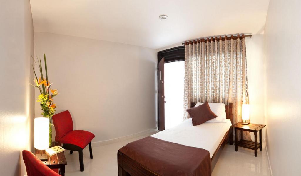Hotel Lusitania Ibagué Szoba fotó